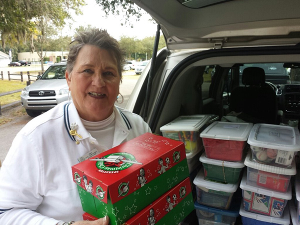 Photos submitted by Patricia Serio Chair Madeline McCulloh loading her vehicle with more gift boxes