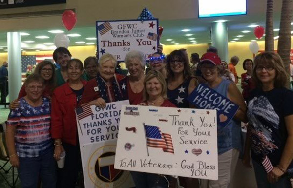 Club members and sister clubs at airport to greet vets