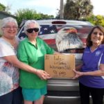 Member Delivering Eyeglasses to Lions Club