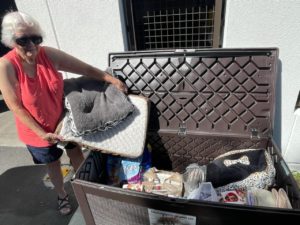 Member Delivering Pet Supplies to Humane Society