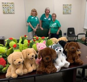 Club Members With Donated Stuffed Animals