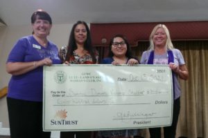 Club Presents Check to Shelter Staffers