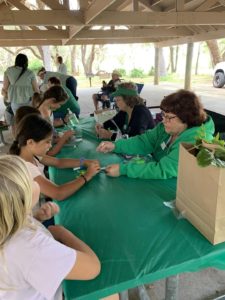 Club Members Helping Kids with Crafts