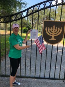 Member Placing Flags on Graves