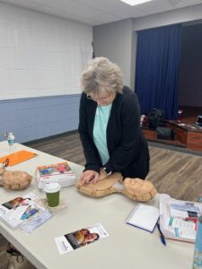 Club Member working on CPR Dummy