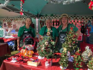 Members in the Arts & Crafts Tent Showing Items the Club Made