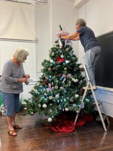 Members Decorating the Club Christmas Tree