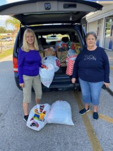 Members Delivery Christmas Presents to Schools