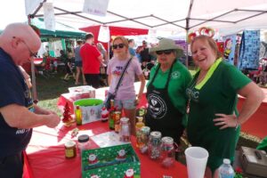  Members (in green shirts) manning the Tombola Booth