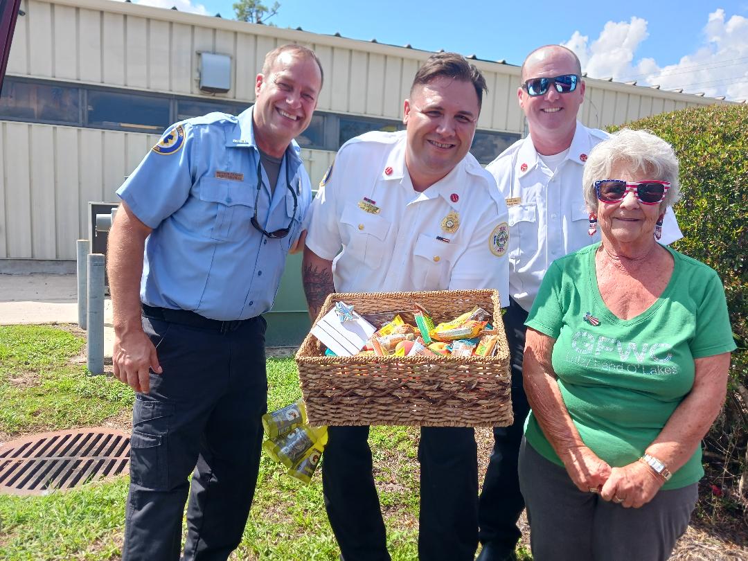 Snack basket delivered to Pasco Fire Rescue/EMT Station 22 by member Dee Knerr (r)