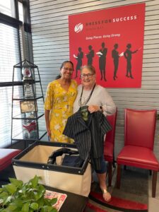 Club Donates Women's Suits to Dress For Success