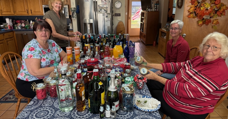 Members Preparing Bottles for the Tombola Booth at the Lutz Arts and Crafts Show.