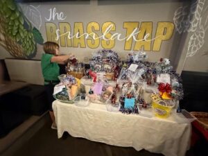 Table with Opportunity Baskets at the Flight to Honor bingo.