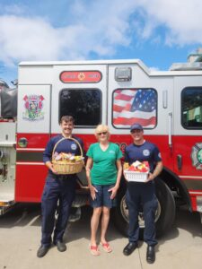 Pasco County Fire Rescue Station 23 crew with Nancy Taylor, accepting their basket(s).
