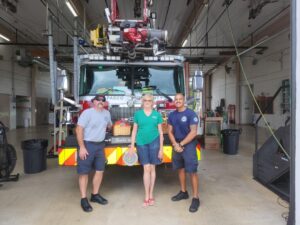 Pasco County Fire Rescue station, on SR 54 west of Land O Lakes. Crew accepting basket from Nancy Taylor.
