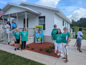 Club members attended a Habitat for Humanity home dedication.