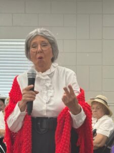 Actor dressed as Susan B. Anthony talks about the difficulty of getting women the right to vote.