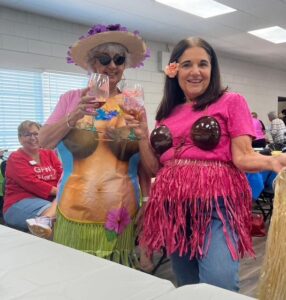 Ladies showing off their tropical outfits.