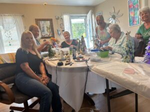 Members working on sea glass trees