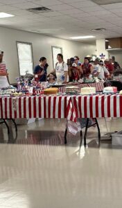 People enter the Lutz Community Center for the cake auction.