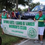 Club Banner Leads the Club's Float and Member Cars.