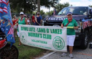 Club banner leads the Club's float and member cars.